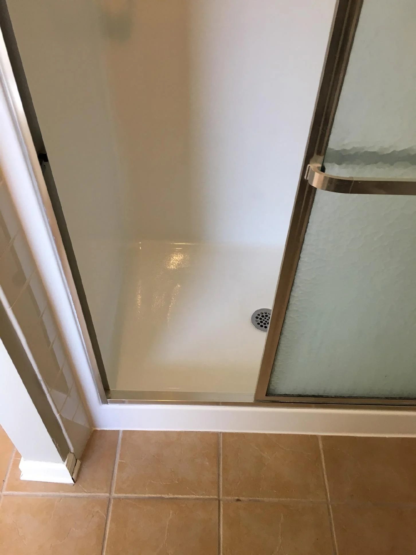 Renewed dormitory or apartment shower base after refinishing