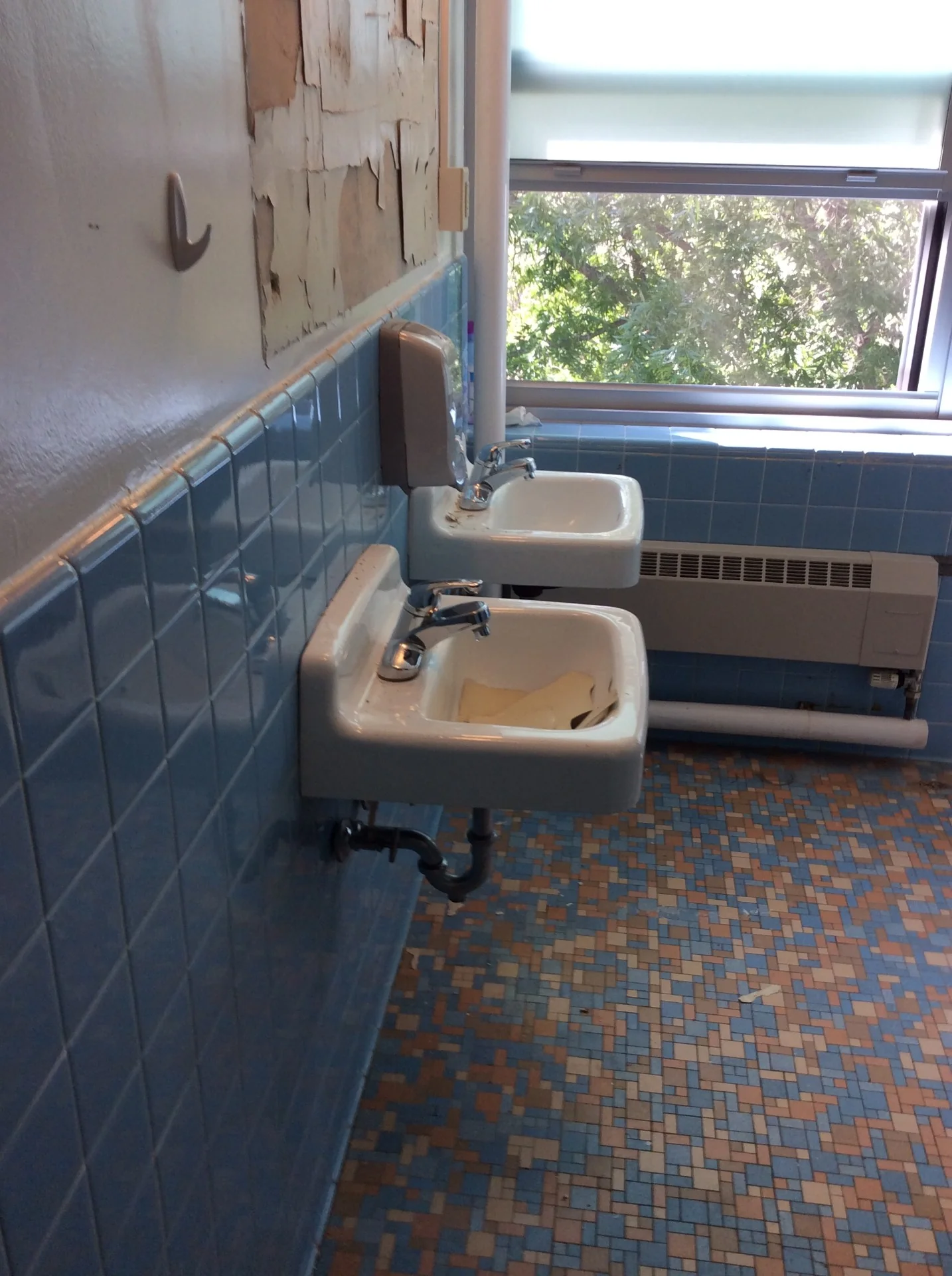 Dormitory sinks, tile walls, and floor before refinishing