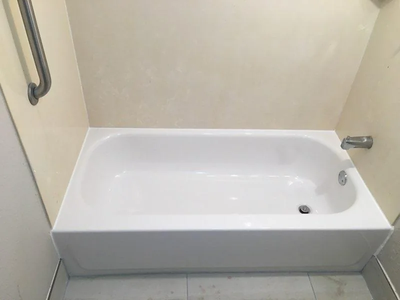 Clean white hotel bathtub after refinishing