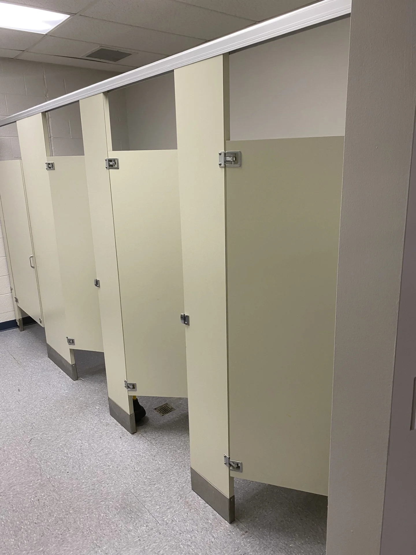 Refinished locker room partitions and flooring