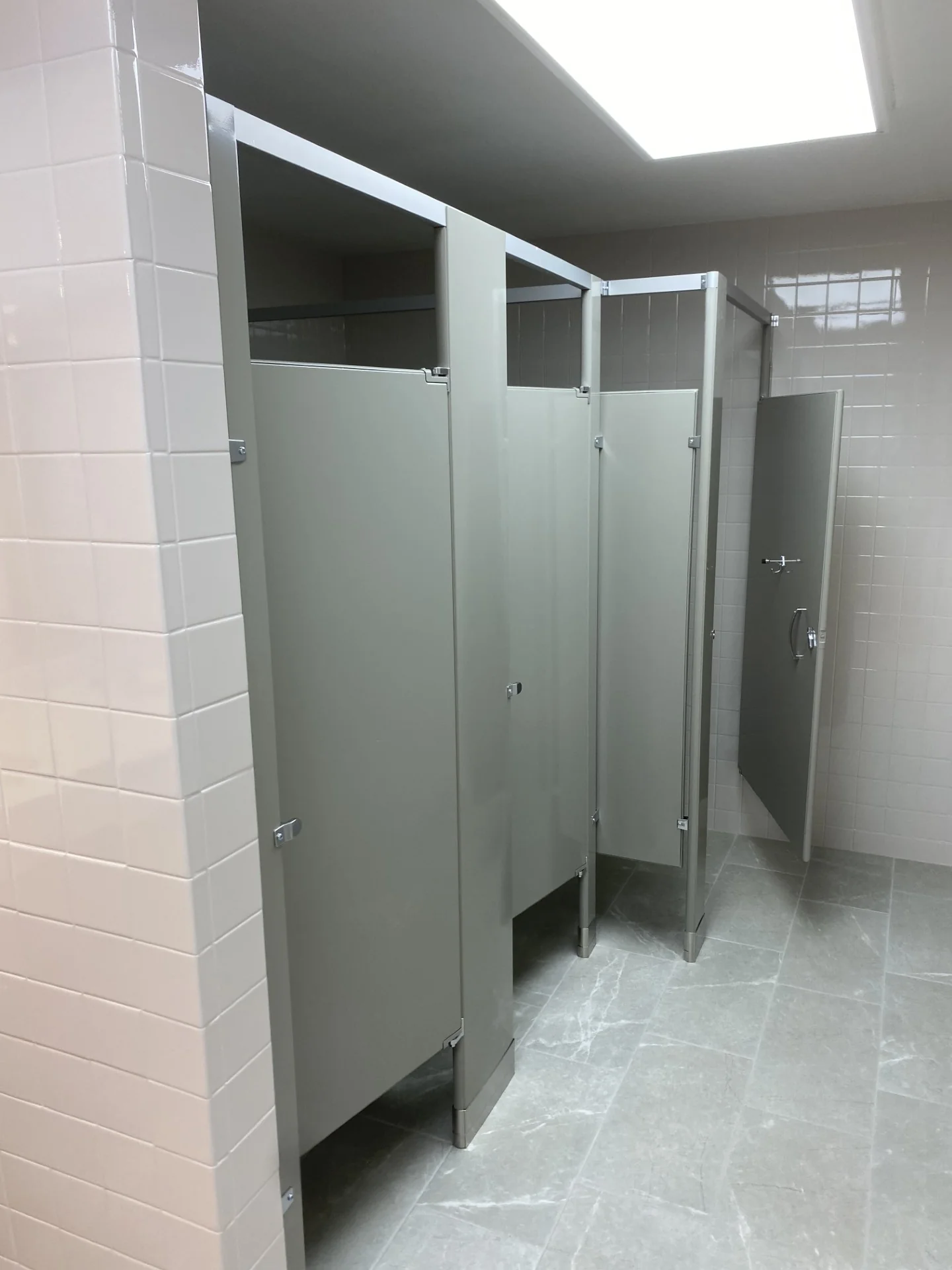 Renewed locker room stalls, walls, and flooring
