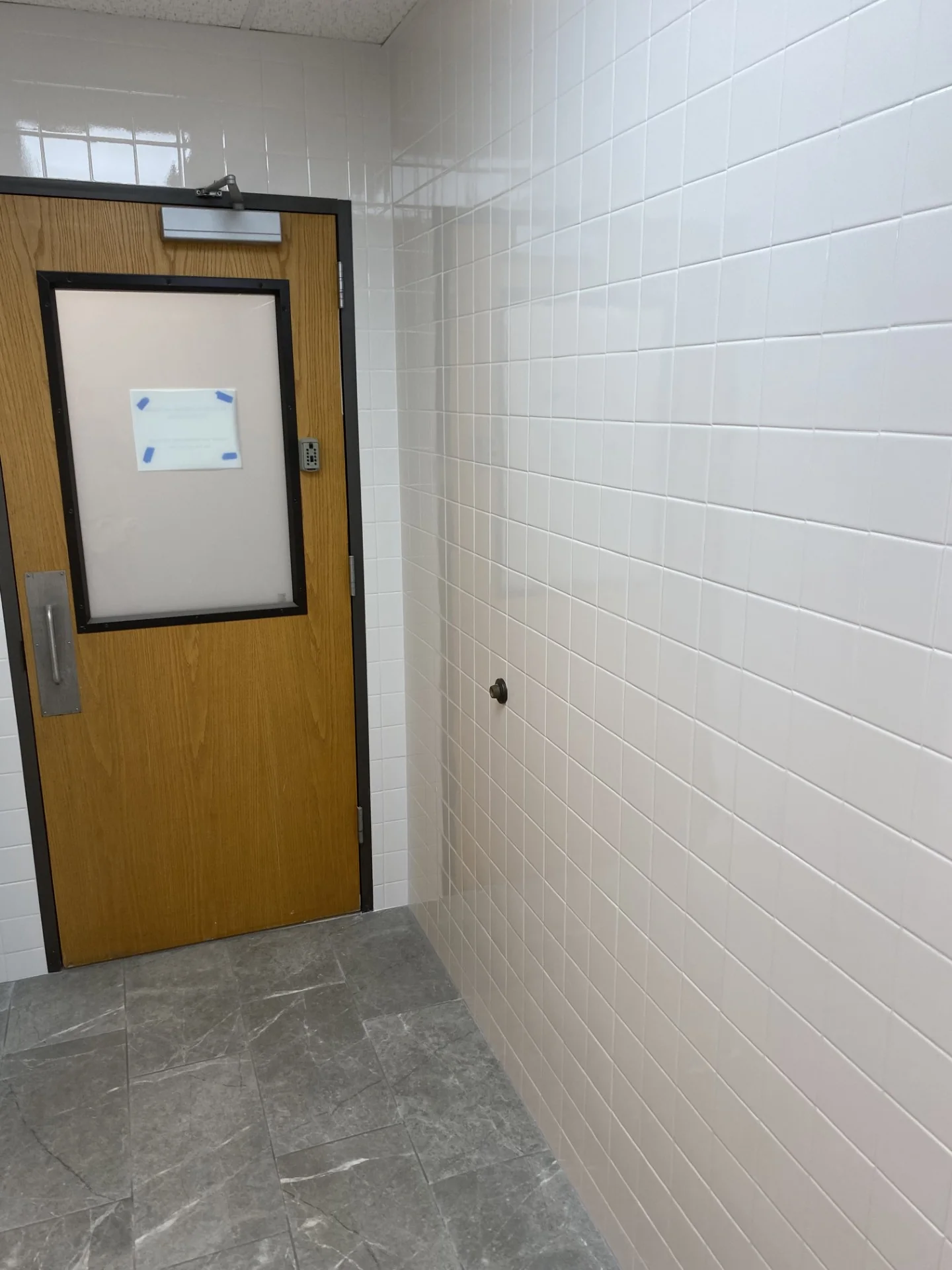 Renewed locker room tile walls and flooring