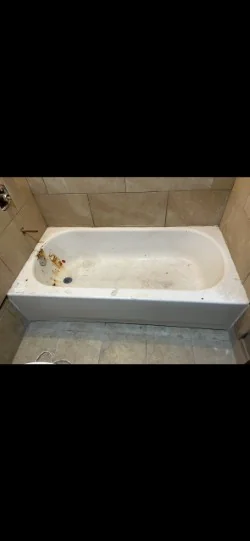Worn and stained bathtub before refinishing