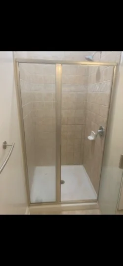Dated shower walls and base before refinishing